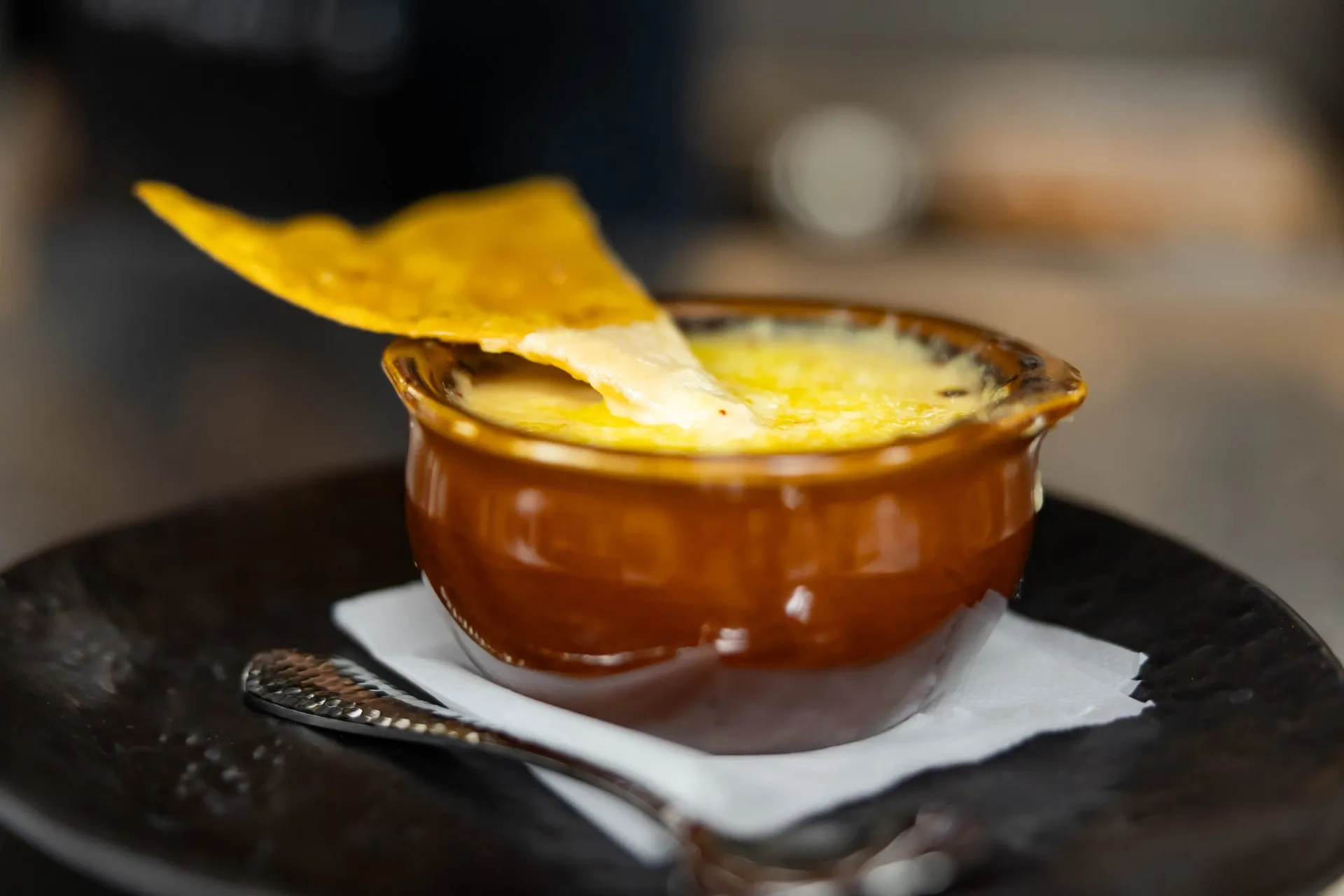 French onion soup topped with melted cheese and a crisp