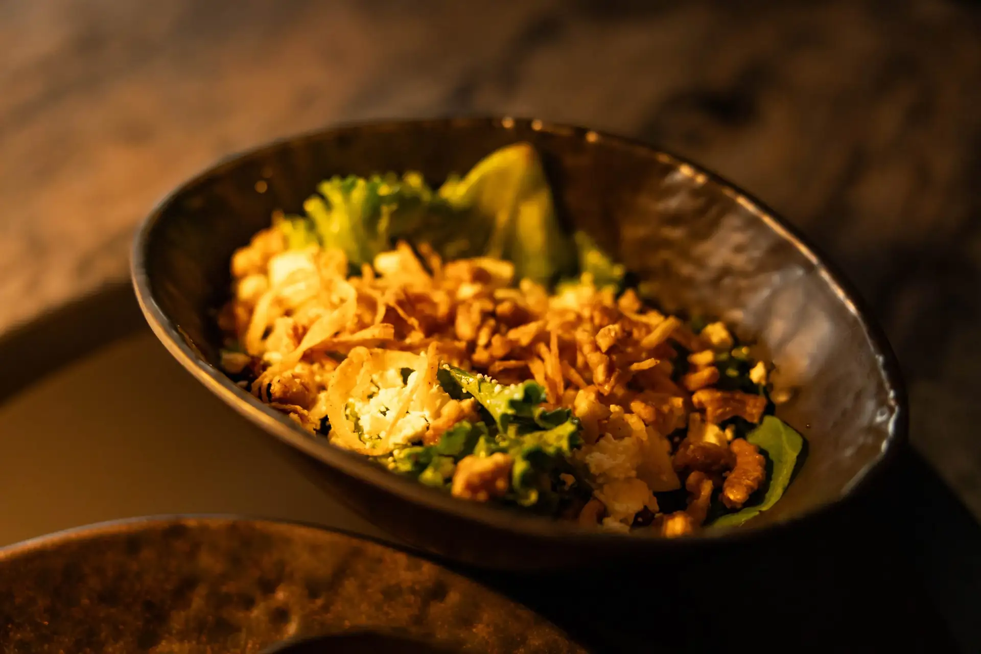 Grain bowl with broccoli and crispy toppings