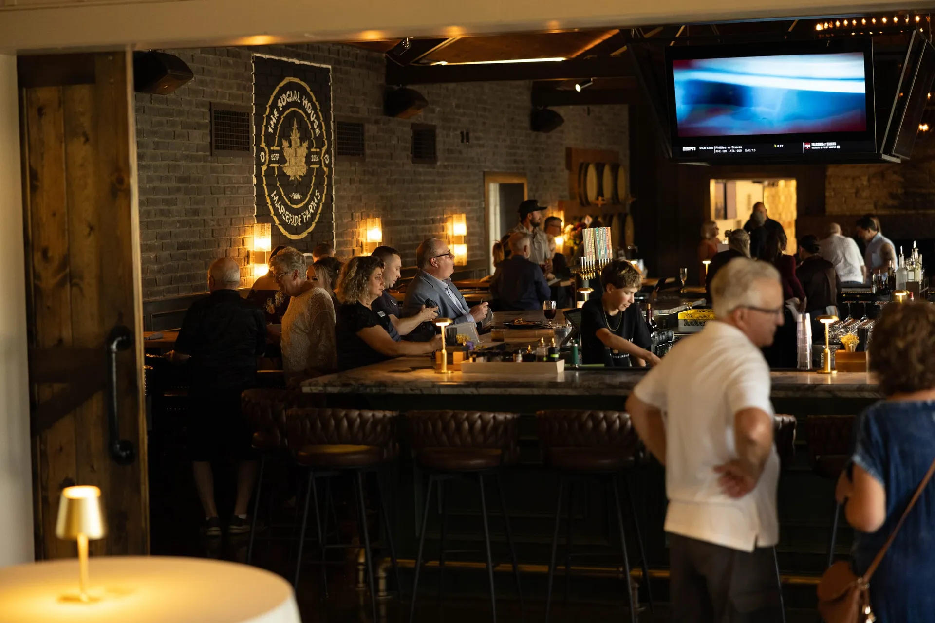The evening crowd filling The Great Room around the central bar
