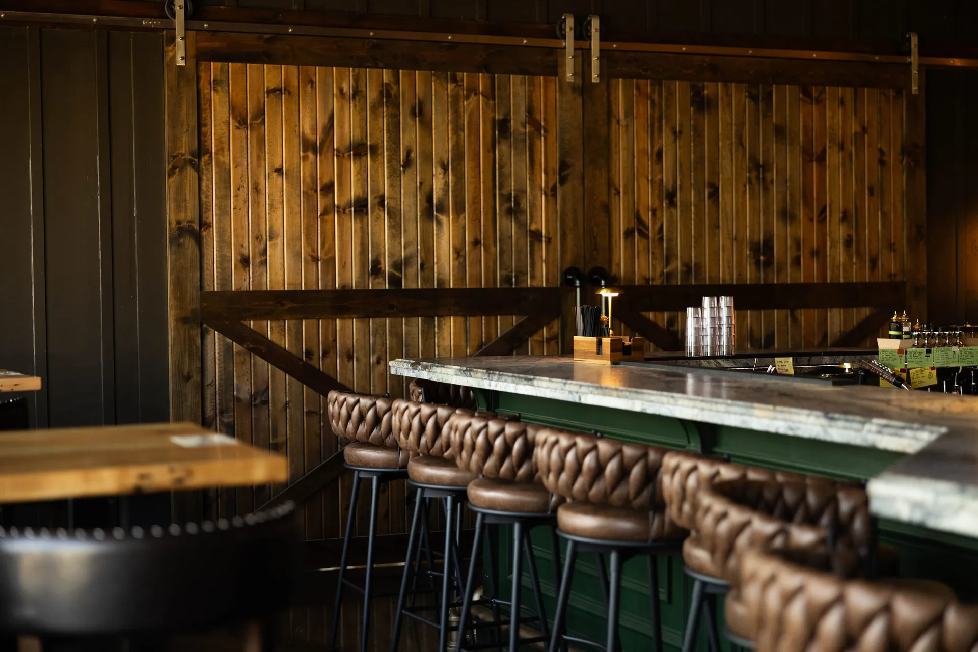 Leather bar stools lining the central bar in The Great Room