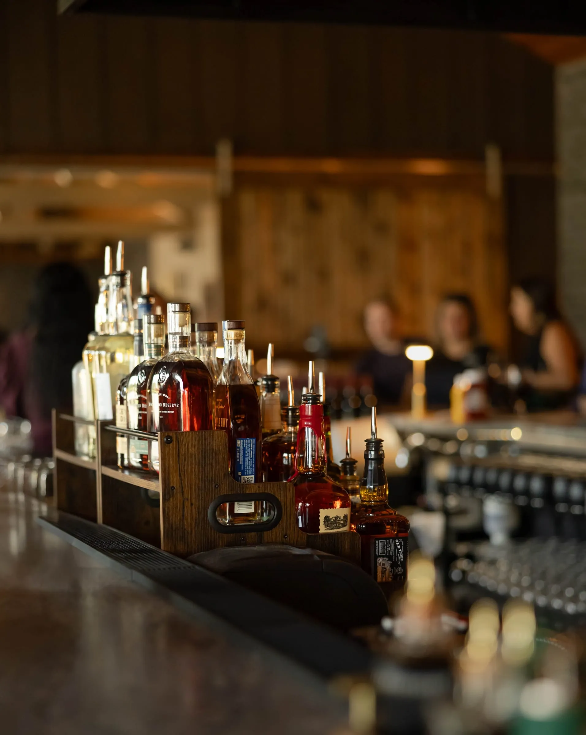 The back bar stocked with spirits as guests settle in