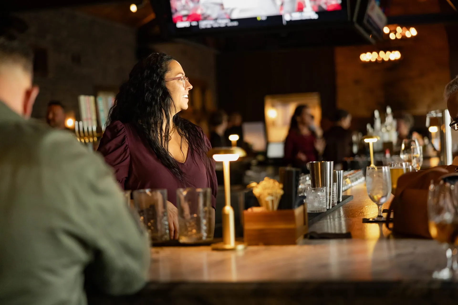 Guests chatting at the bar in The Great Room