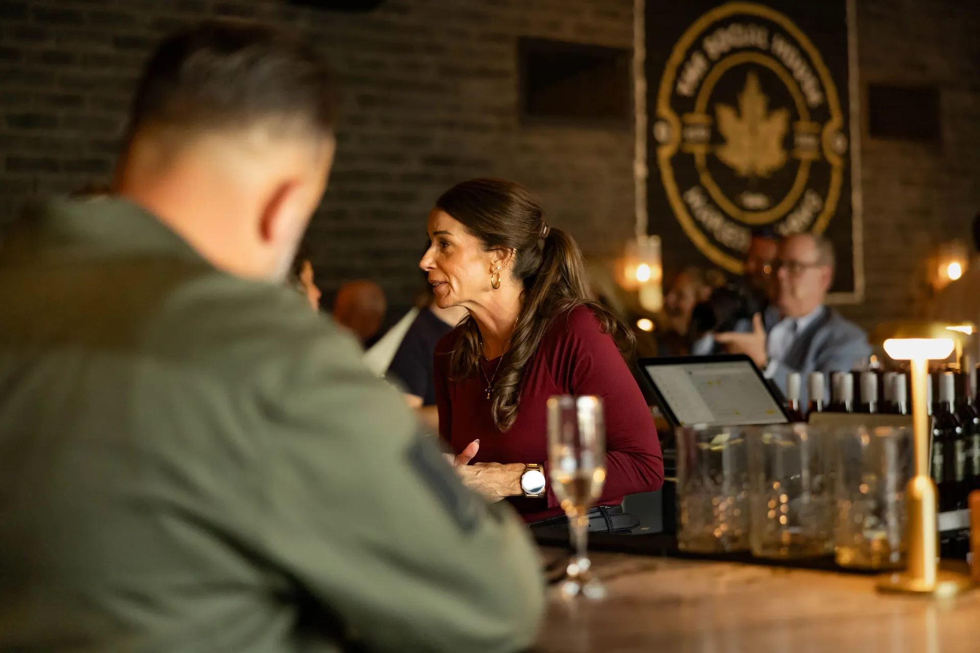 Friends talking over drinks at the bar