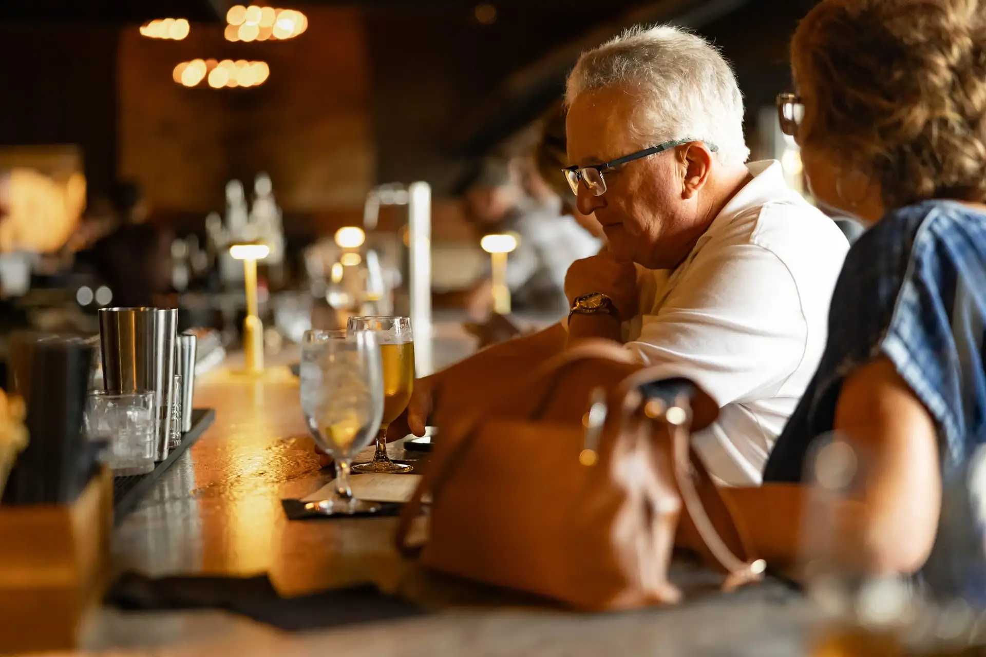 Guests enjoying drinks at the bar
