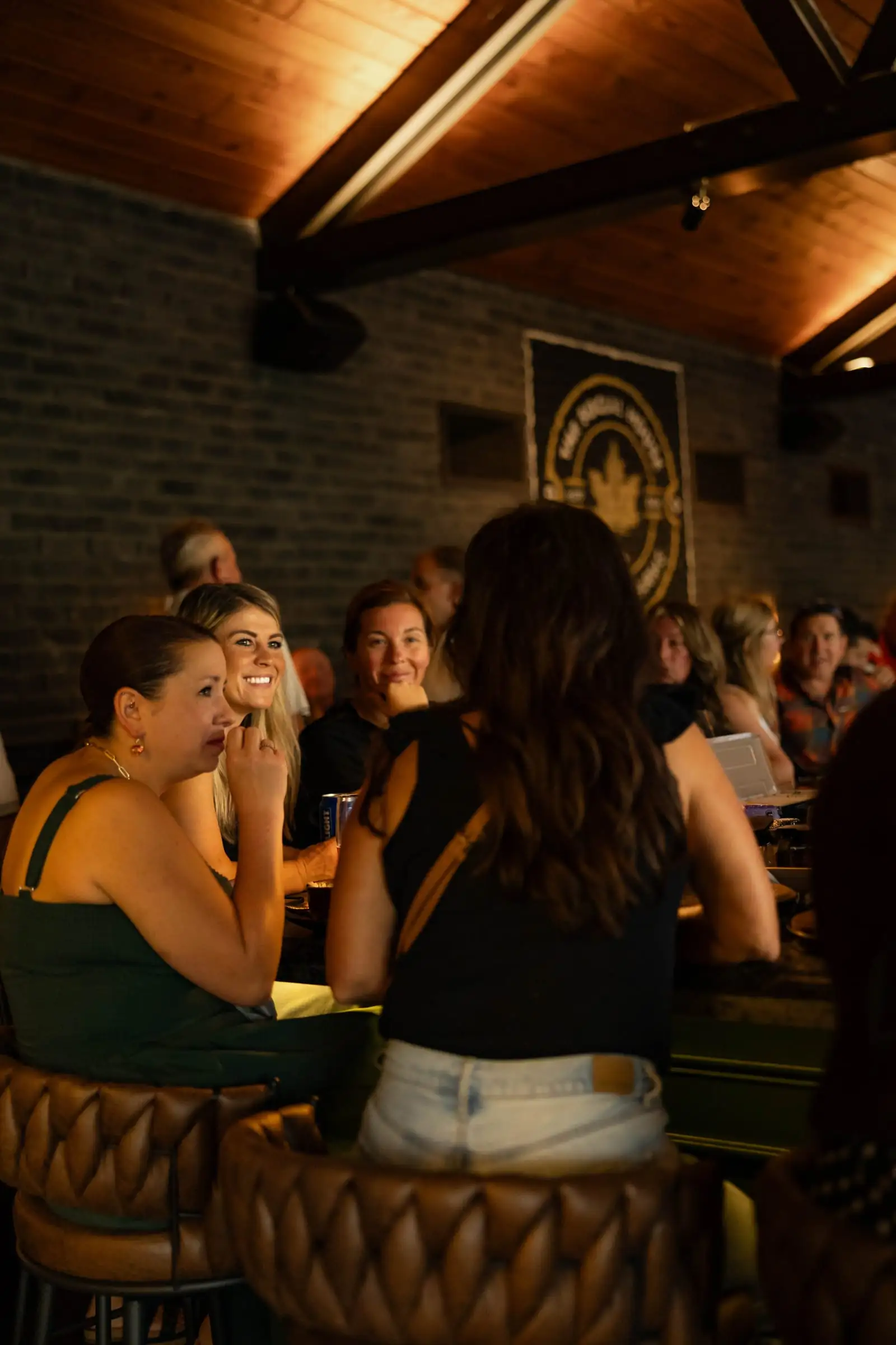 Friends laughing together at the bar