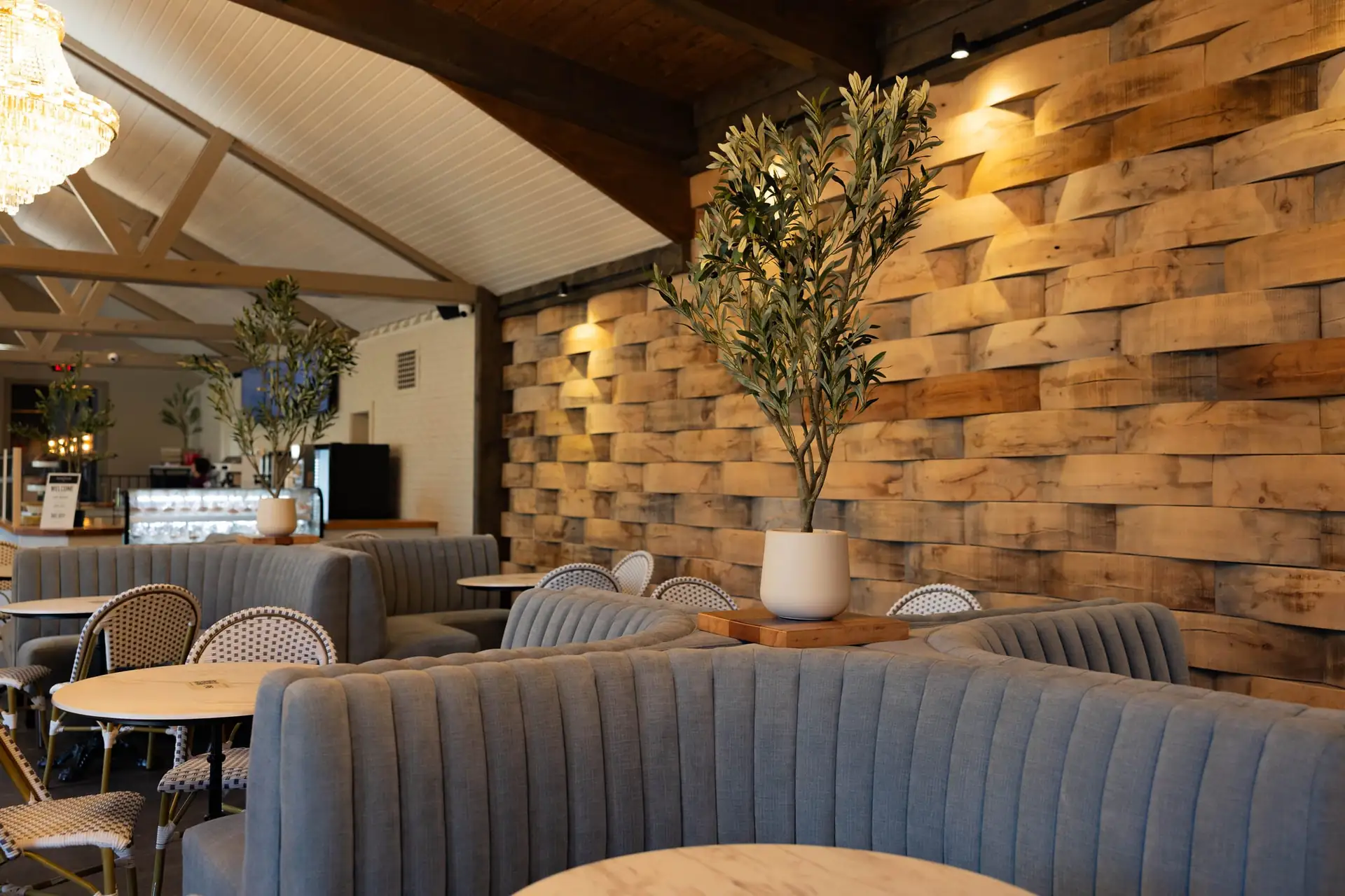 The Press, with its barrel-stave wall, olive trees and vaulted white ceiling