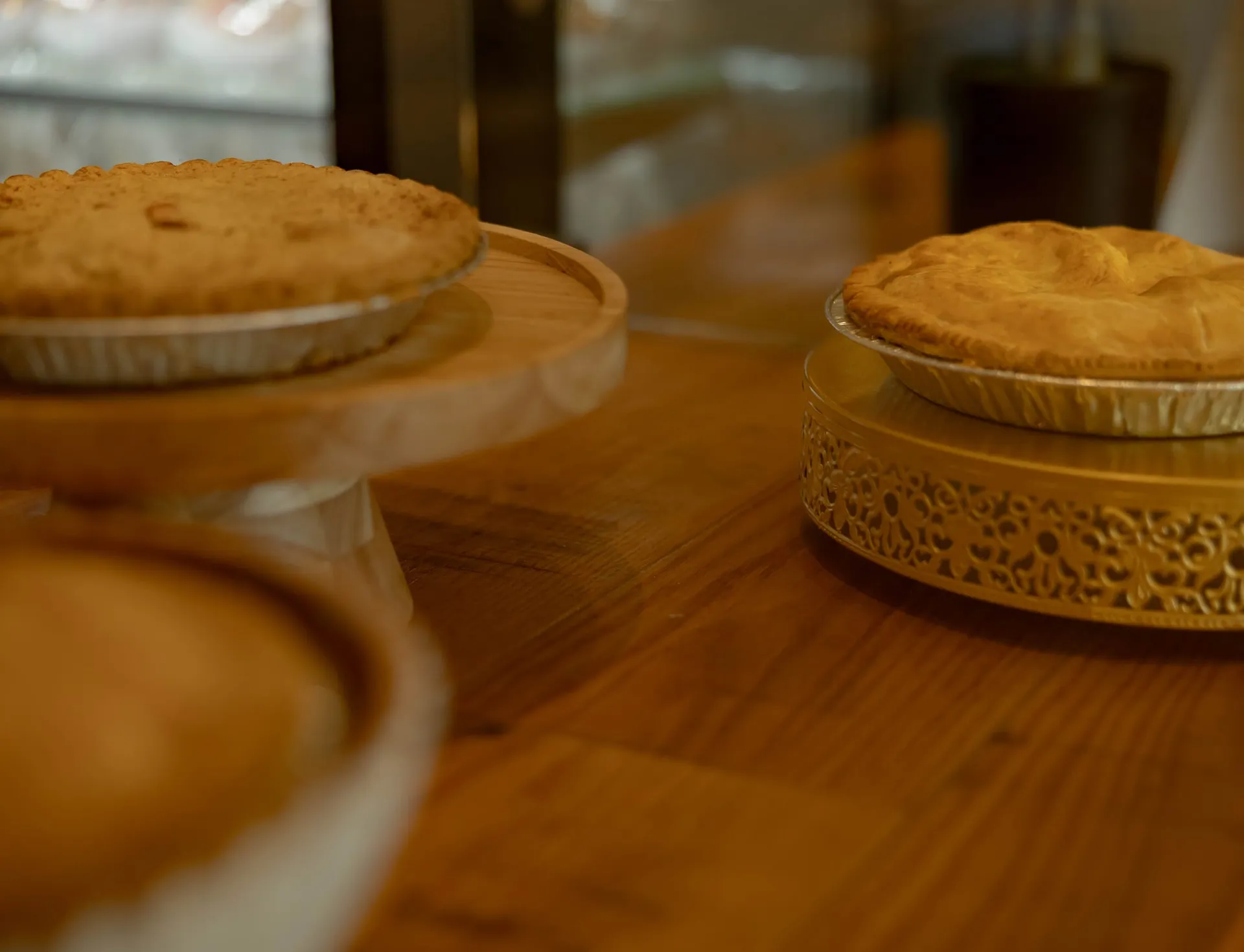 Fresh-baked pies on cake stands in The Press